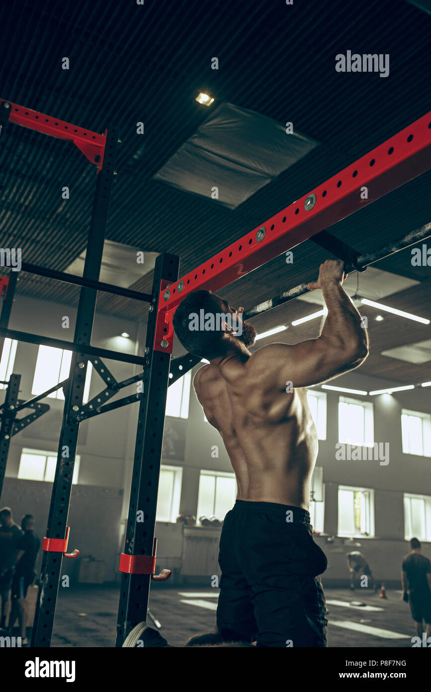 Concept power, strength, healthy lifestyle, sport. Powerful attractive