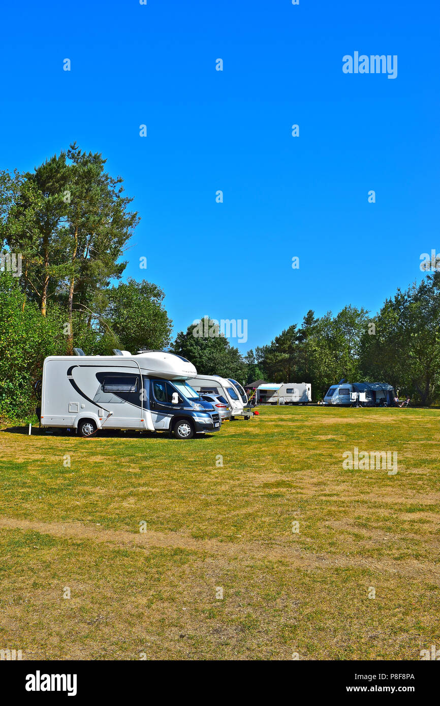 Neat rows of modern caravans & motorhomes parked up on site at Gowerton
