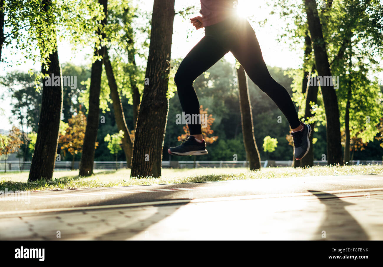 Woman running in public park hi-res stock photography and images - Alamy