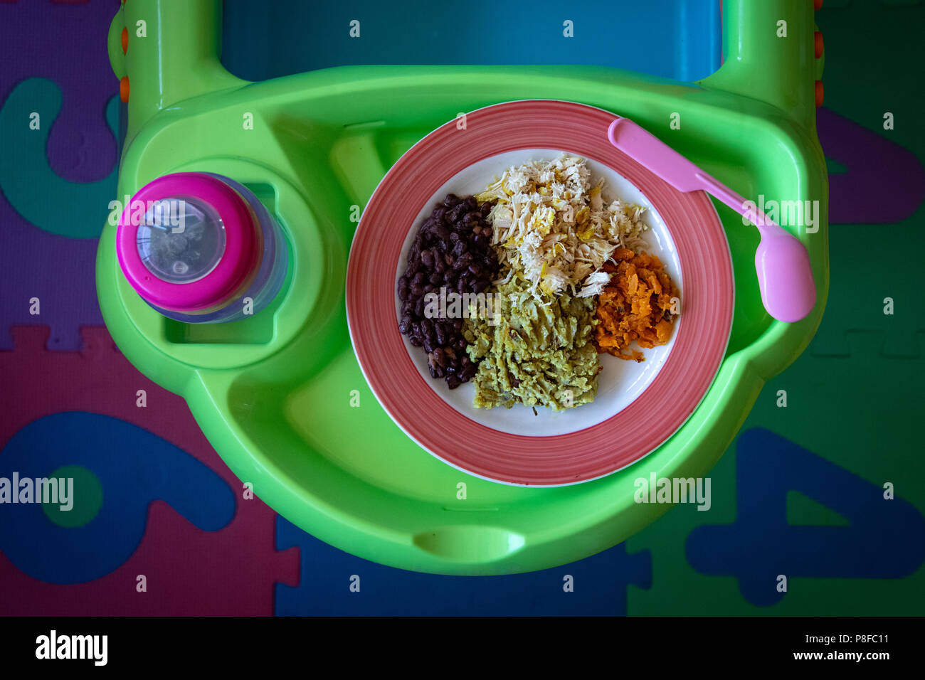 Overhead view of baby food on a plate Stock Photo
