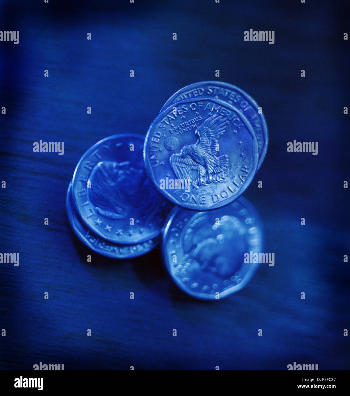 5 American Dollar Coins Blue Cast Stock Photo