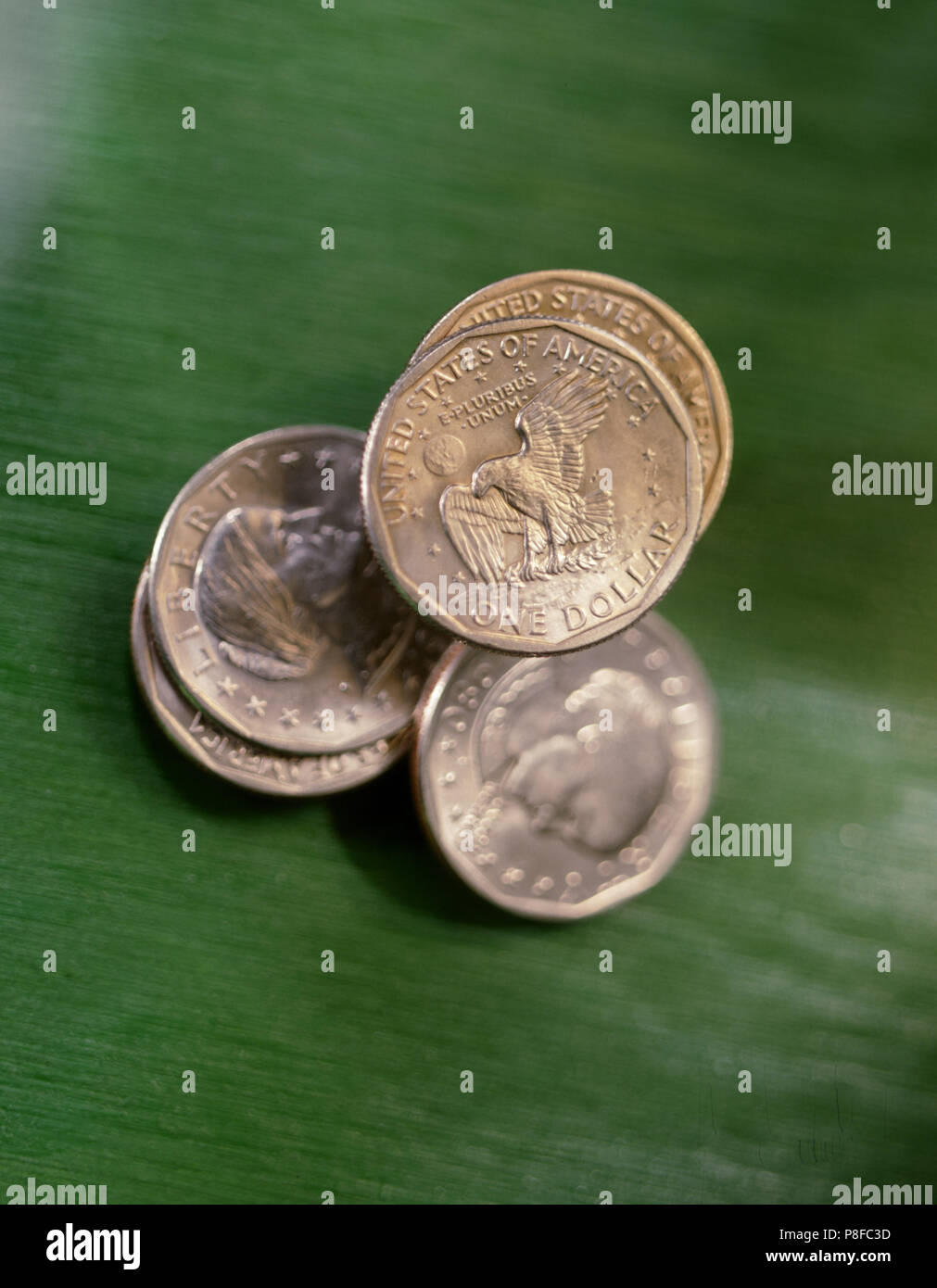 5 American Dollar Coins Green Stock Photo
