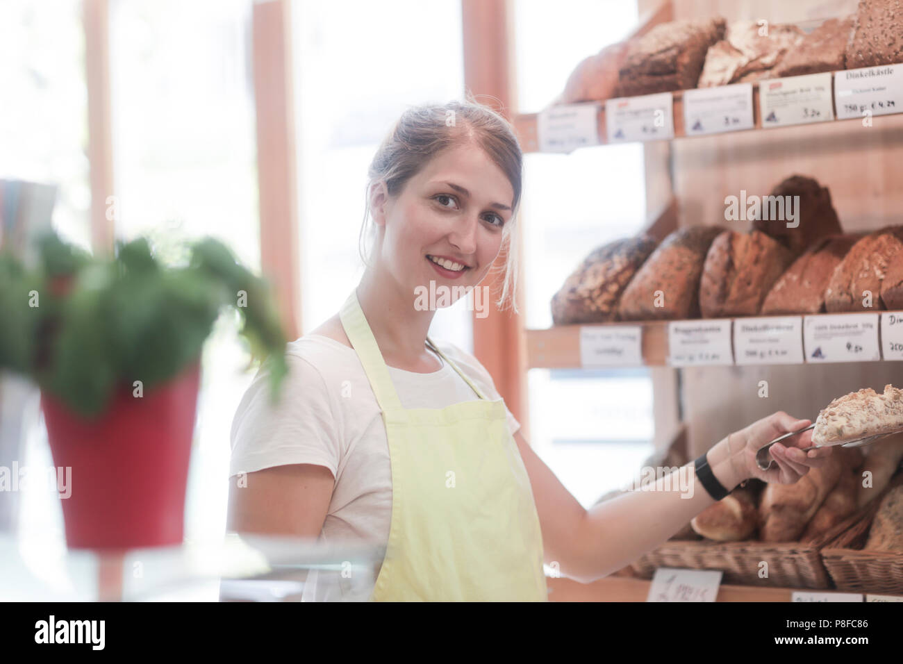 Young baker assistant hires stock photography and images Alamy