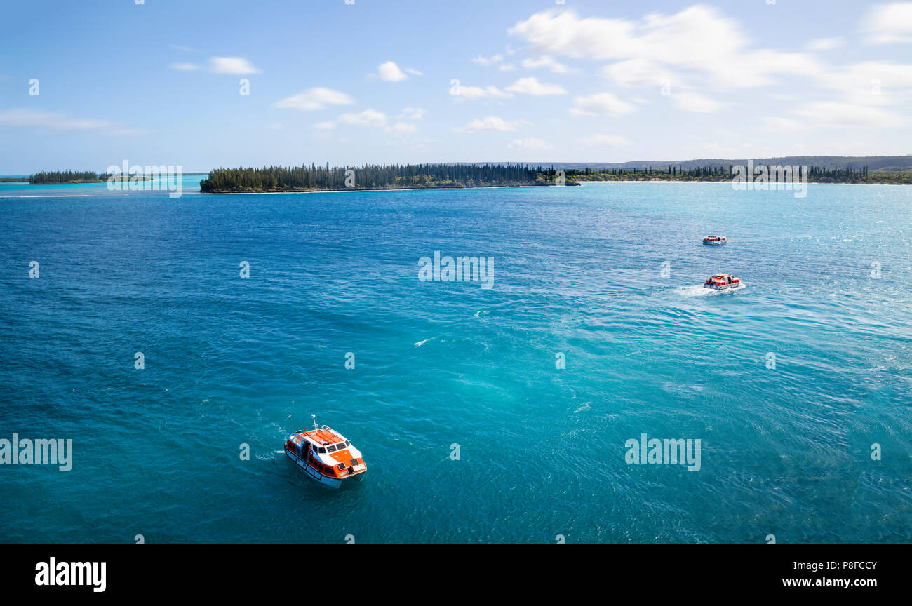 Tender boats returning to the cruise ship. from the Isle of Pines New Caledonia Stock Photo