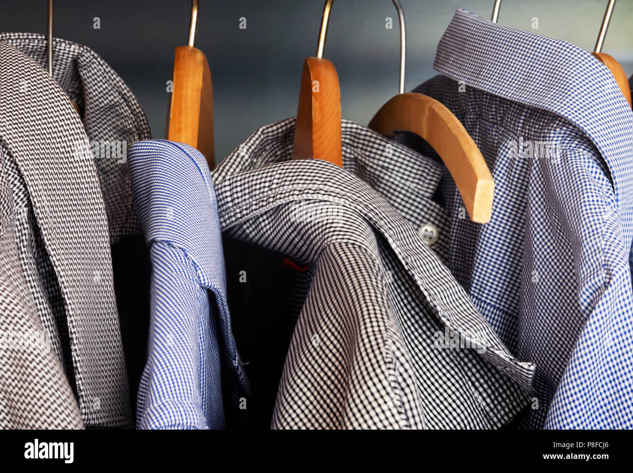 Shirts hanging on coathangers Stock Photo