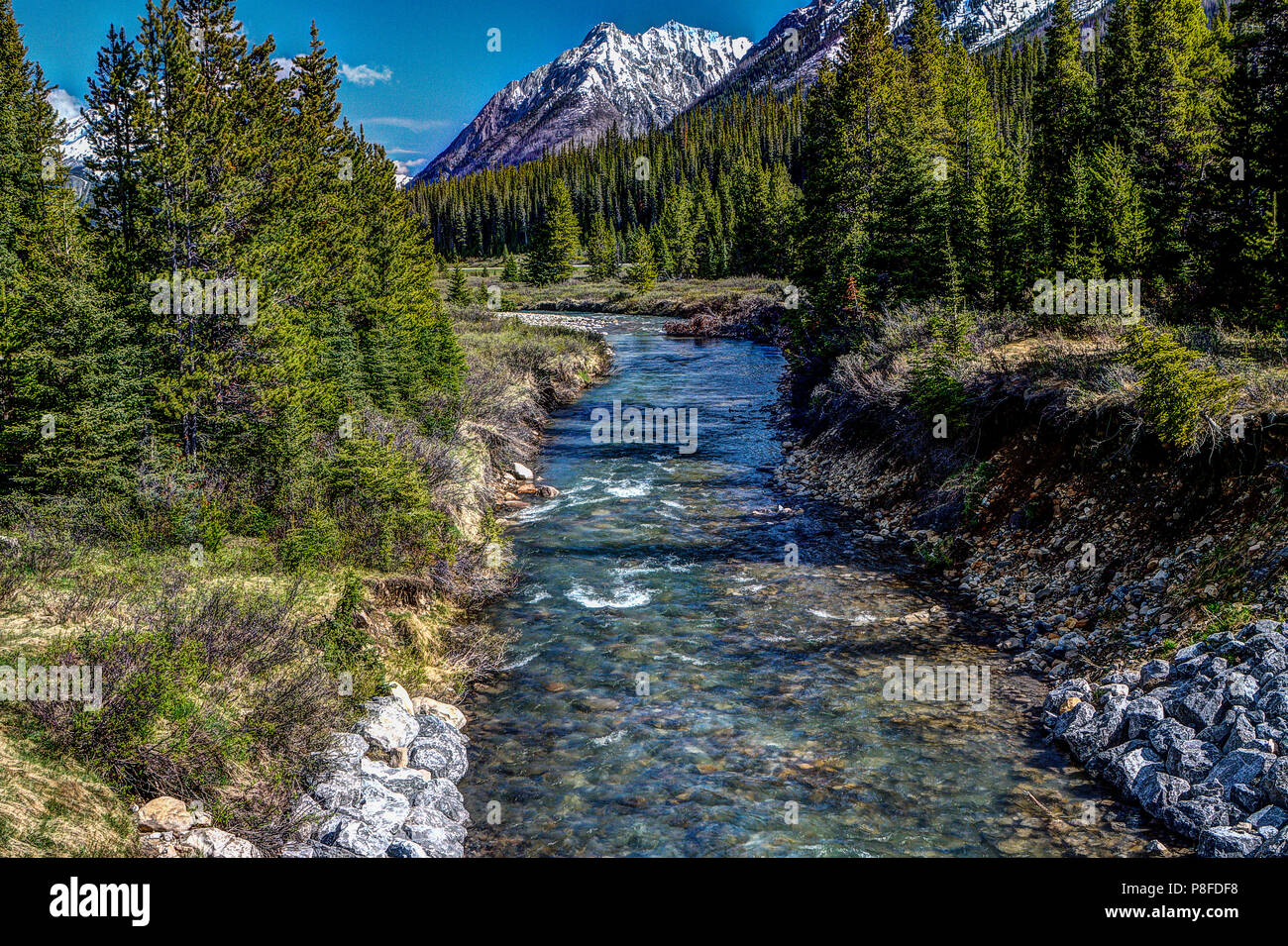 Mountain scene whre river flowes towards camera and mountains in ...