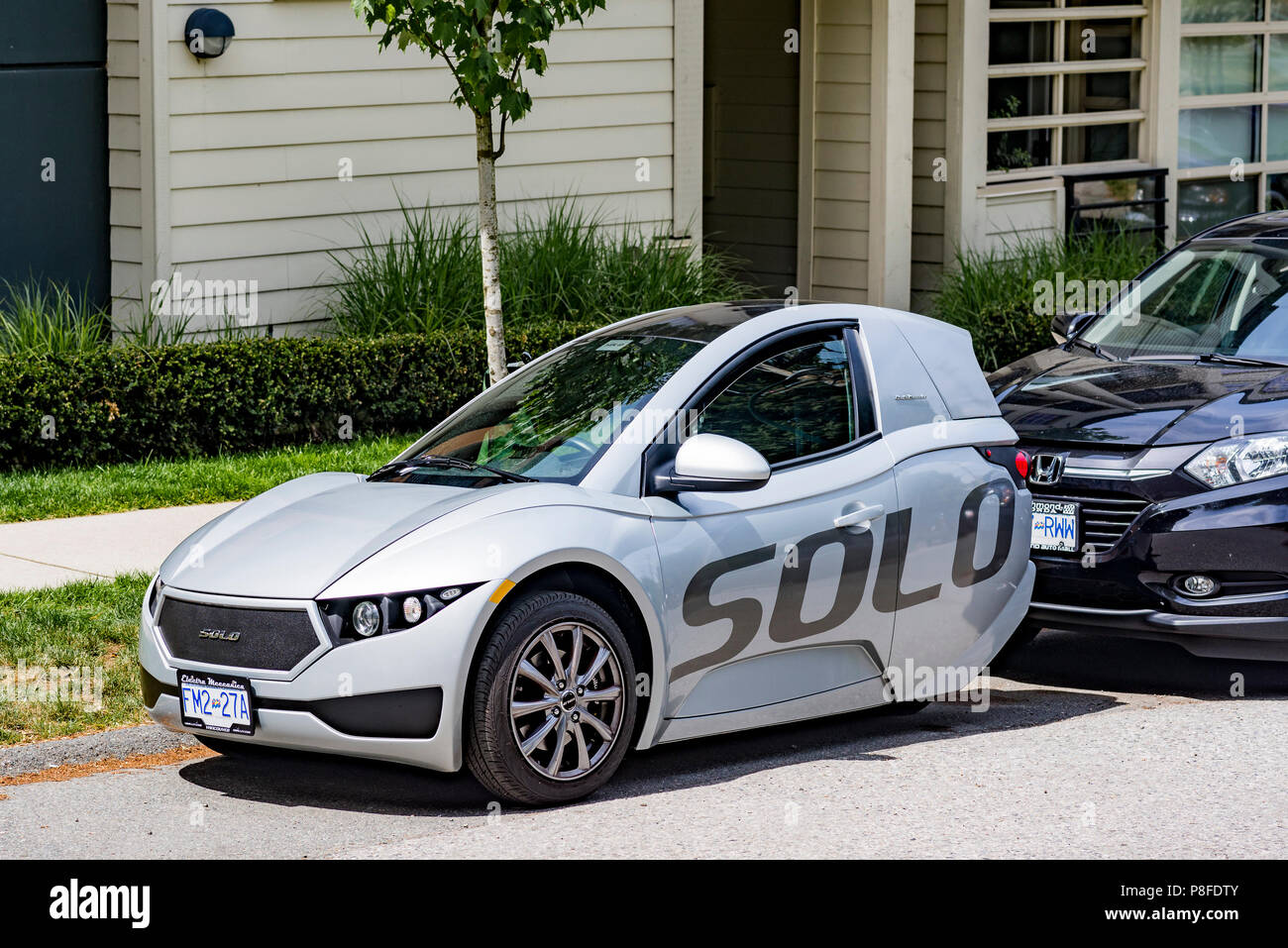 single-seater electric vehicle, Solo, 3 wheeled car. Stock Photo