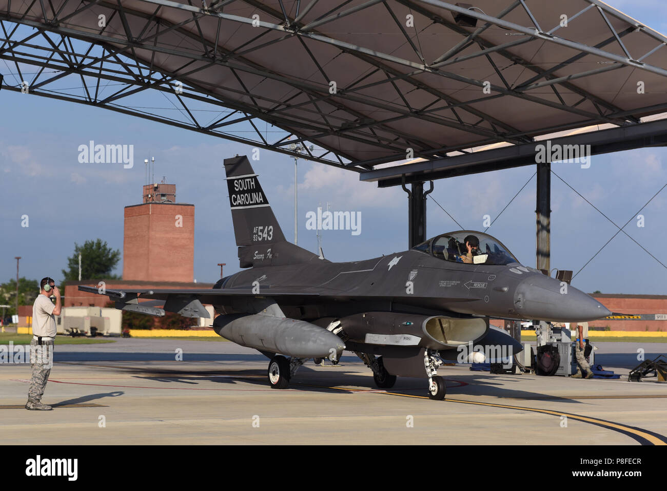 U.S. Air Force aircraft maintenance personnel and fighter pilots from the South Carolina Air National Guard's 169th Fighter Wing at McEntire Joint National Guard Base, South Carolina, perform preflight and launch operations to deploy F-16 Block 52 Fighting Falcon fighter jets for an AEF rotation to Southwest Asia, July 11, 2018. The South Carolina Air National Guard’s 169th Fighter Wing is deploying nearly 300 Airmen and approximately a dozen F-16 Block 52 Fighting Falcon fighter jets to the 407th Air Expeditionary Group in Southwest Asia in support of an Air Expeditionary Force rotation. (U.S Stock Photo