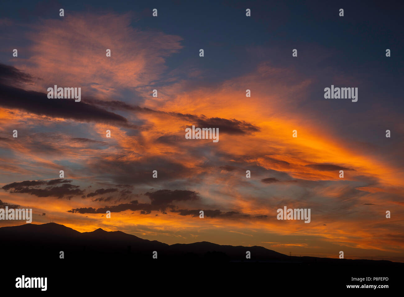 Vibrant sunrise over the Wasatch Mountains, Salt Lake County, Utah Stock Photo