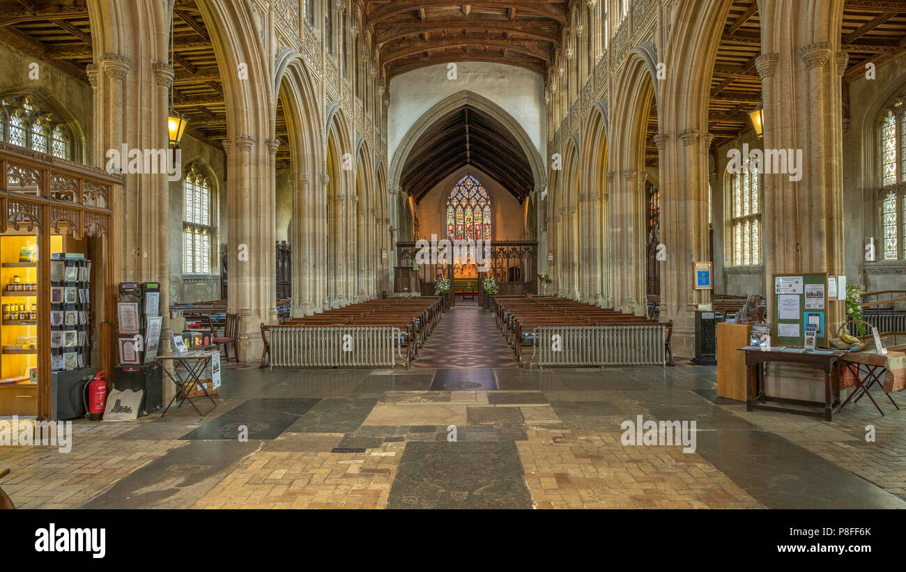 Interior of St. Peter and St. Paul church in Lavenham a Grade I listed parish church. The font and much of the church date from the 14th Century. Stock Photo