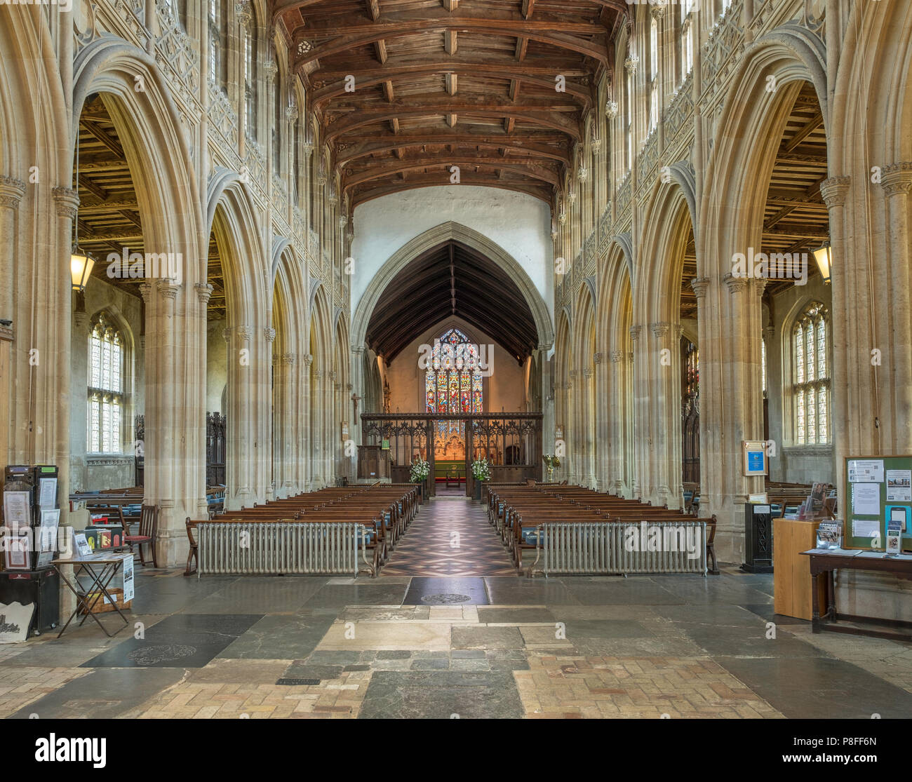 Interior of St. Peter and St. Paul church in Lavenham a Grade I listed parish church. The font and much of the church date from the 14th Century. Stock Photo