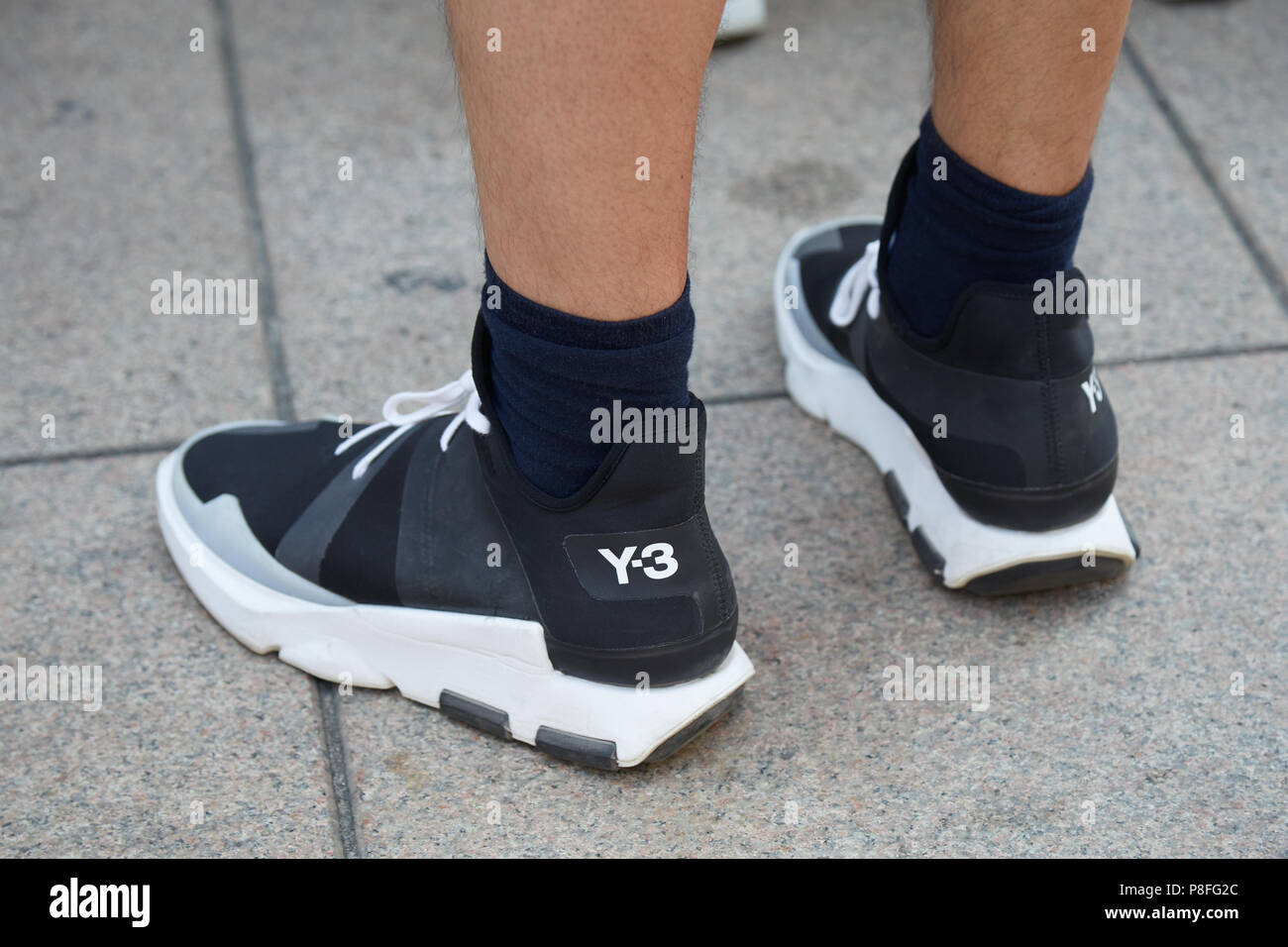 MILAN - 15: Man with Y3 black and white sneakers before Alberta Ferretti fashion show, Milan Fashion Week street style on June 15, 2018 Stock Photo - Alamy