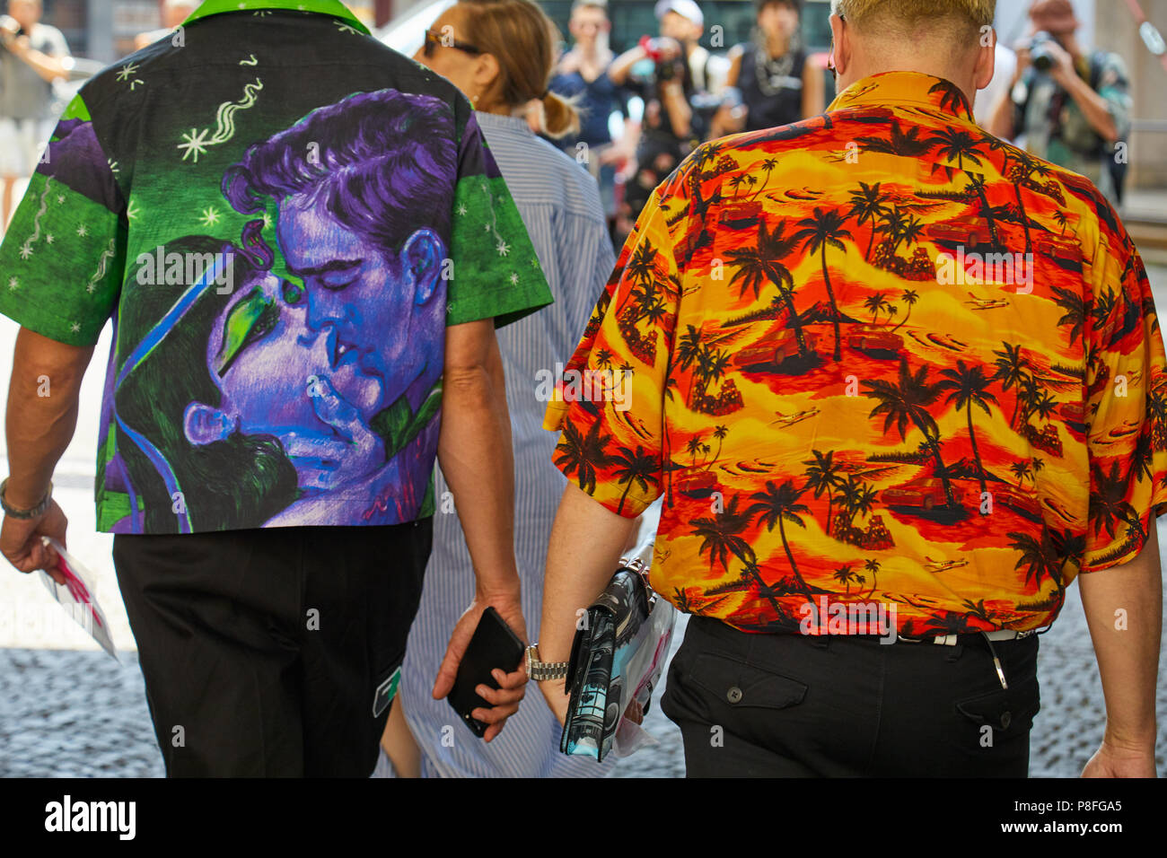 MILAN - JUNE 16: Men with red and yellow shirt and Prada blue and purple  Cleopatra kiss shirt before Marni fashion show, Milan Fashion Week street  sty Stock Photo - Alamy