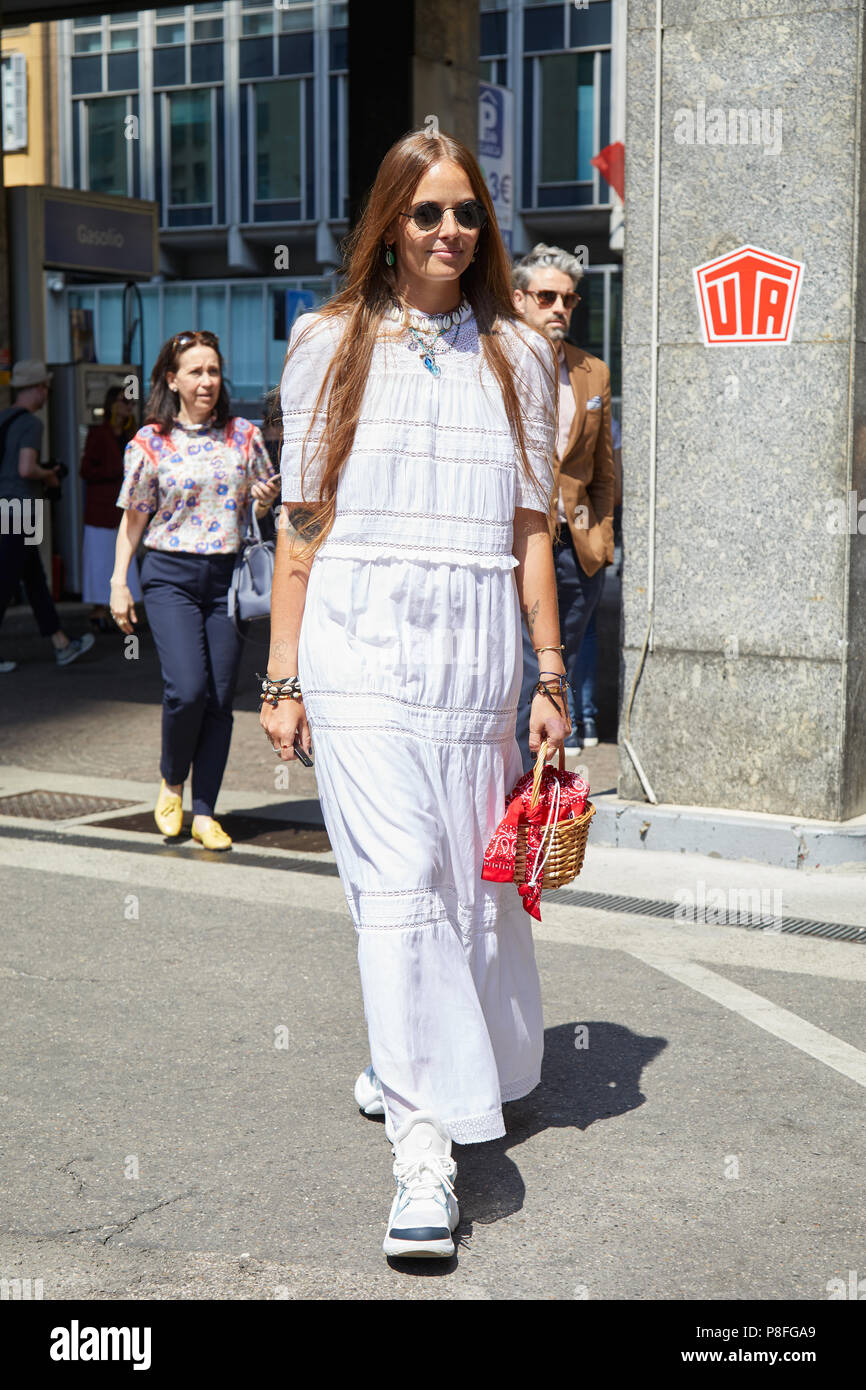 MILAN - JUNE 16: Carlotta Oddi with white dress and wicker basket bag  before Marni fashion show, Milan Fashion Week street style on June 16, 2018  in M Stock Photo - Alamy