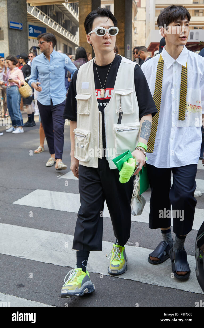 - JUNE 16: Guest with yellow green Balenciaga shoes, beige jacket and white before Marni fashion show, Milan Fashion Week street styl Stock Photo - Alamy