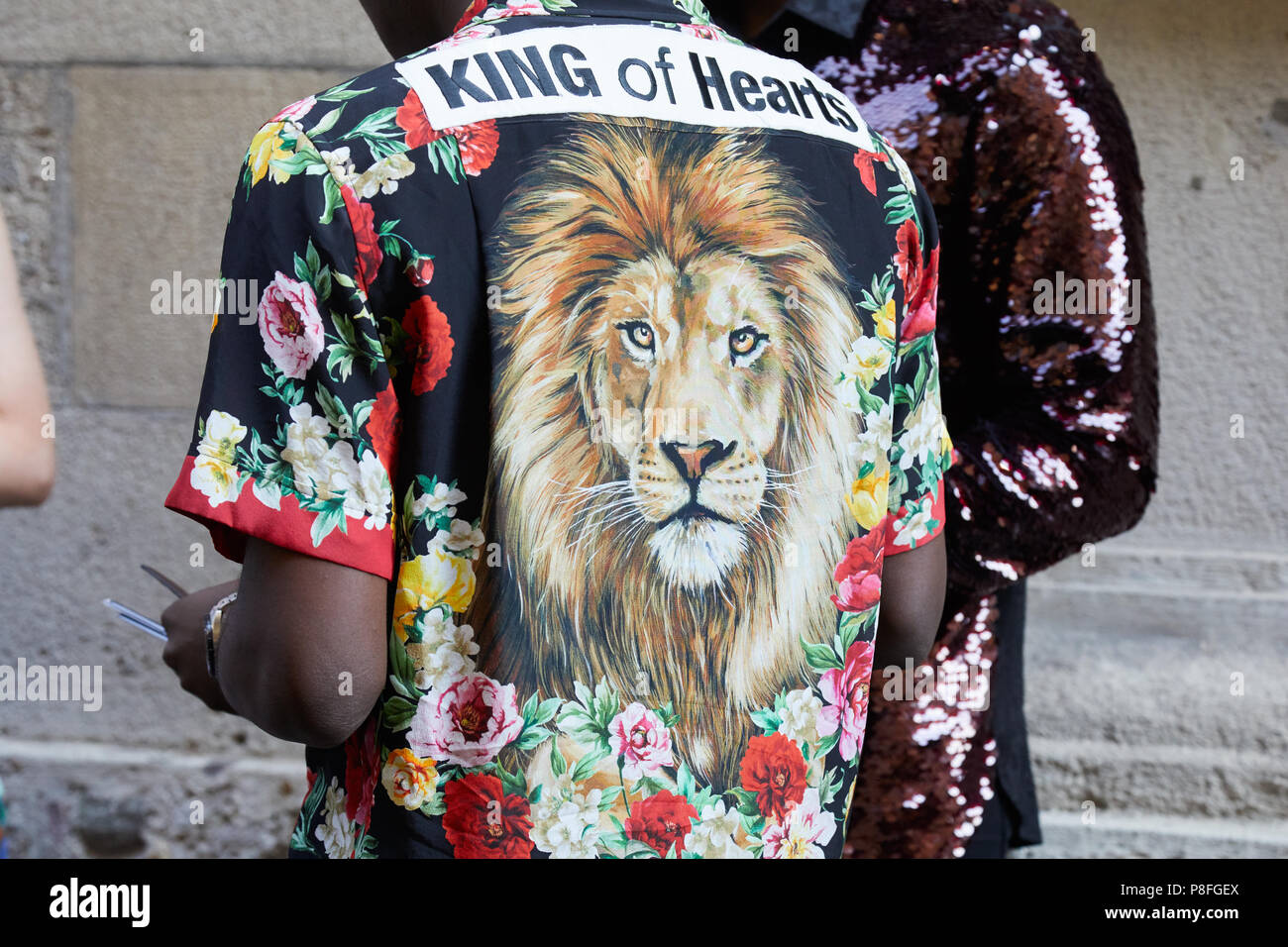 MILAN - JUNE 16: Man with shirt with floral and lion head design before  Versace fashion show, Milan Fashion Week street style on June 16, 2018 in  Mila Stock Photo - Alamy