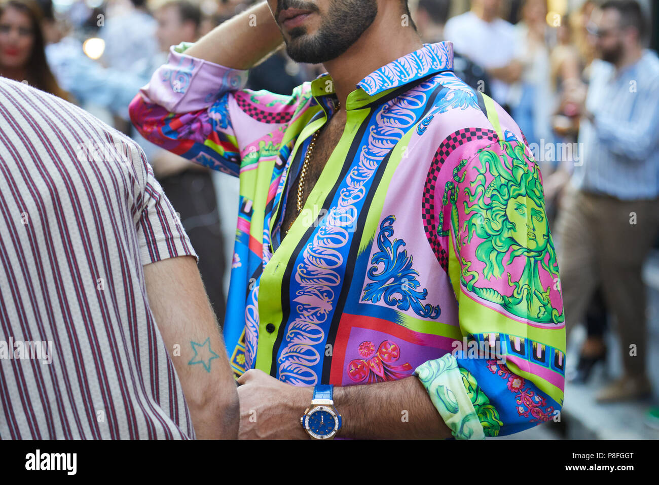 Man with colorful Versace shirt 