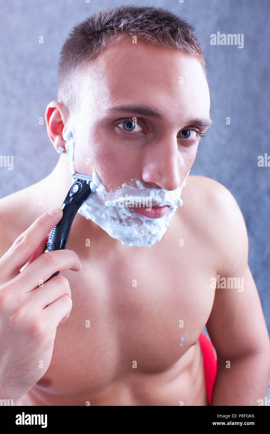 shaving beard with razor