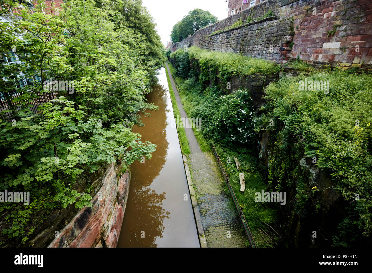 The shropshire union canal and chester canal beneath the old city walls of chester including roman section cheshire england uk Stock Photo