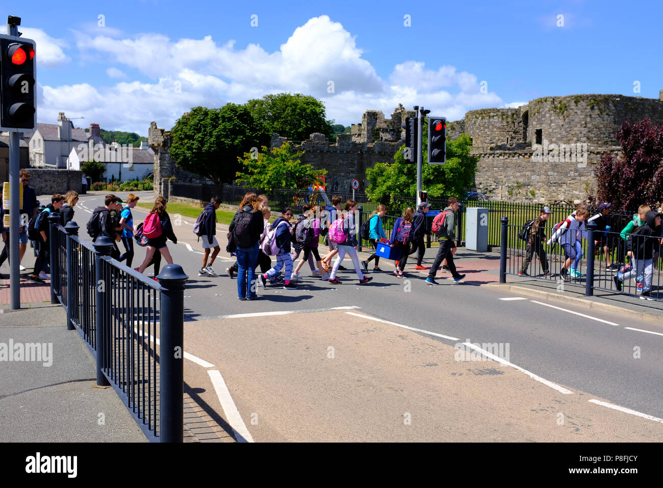 School children crossing the road outside Beaumaris Castle, Beaumaris