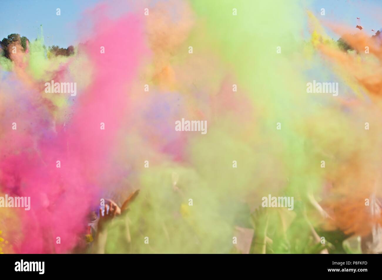 People throwing packs with coloured dust at Holi festival of colours Stock  Photo - Alamy