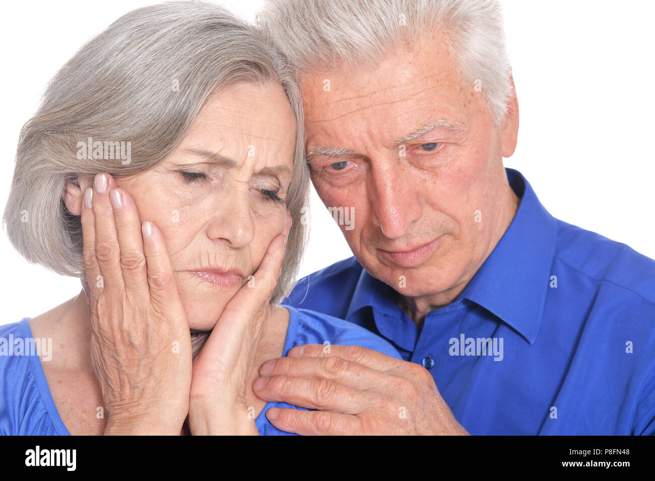 portrait of  sad senior couple embracing Stock Photo