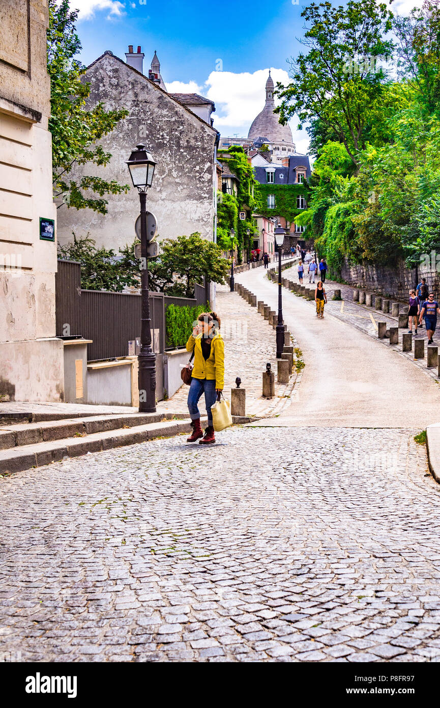 The winding famous Rue de l'Abreuvoir in Montmartre offers views of SacréCœur Basilica, Paris