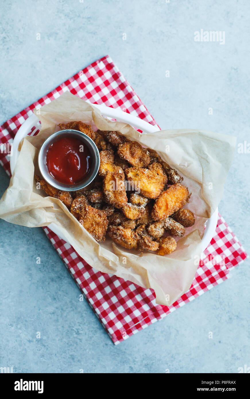 Fried cheese curds in basket with ketchup Stock Photo Alamy