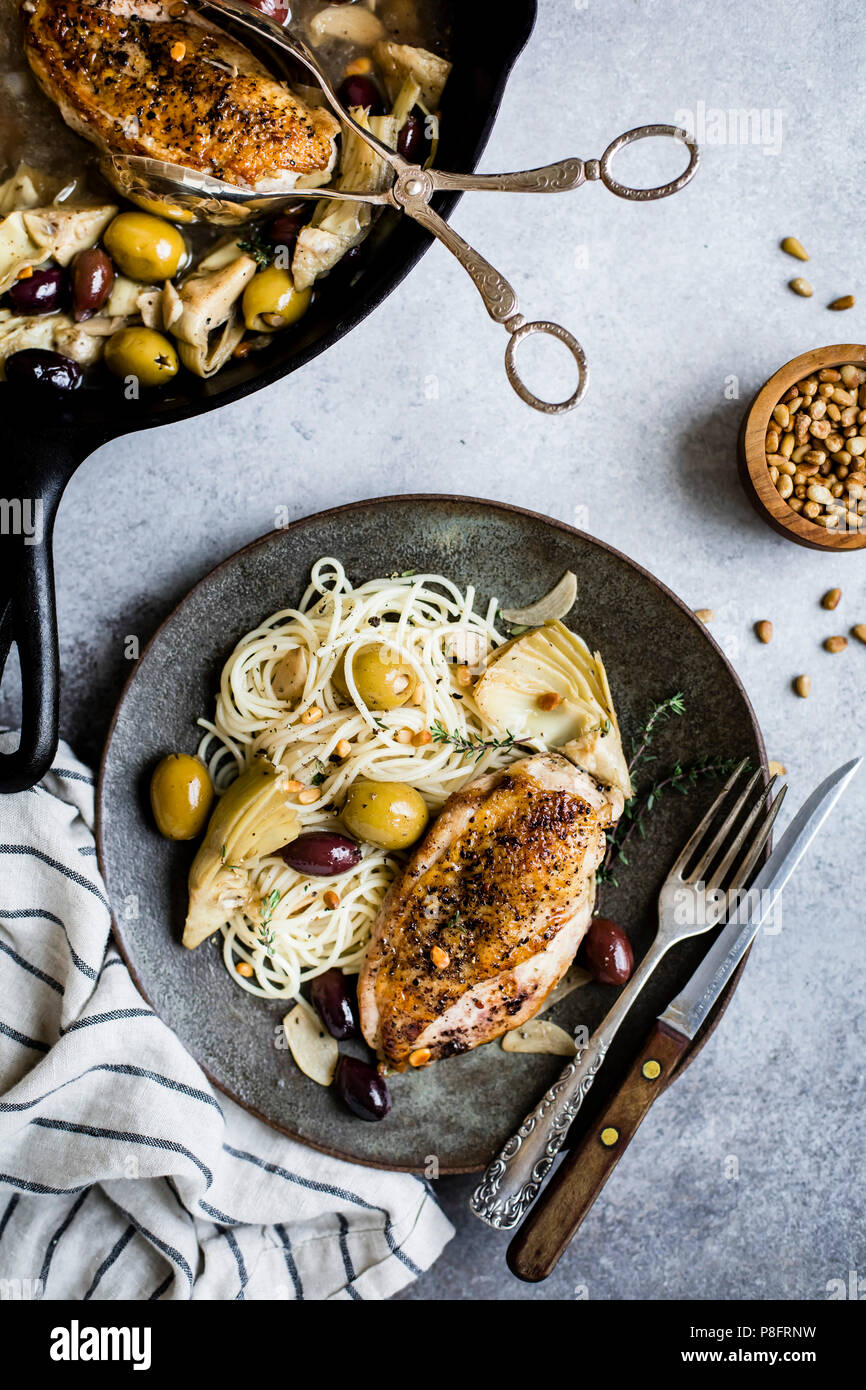 Garlic White Wine Skillet Chicken with Olives & Artichokes Stock Photo