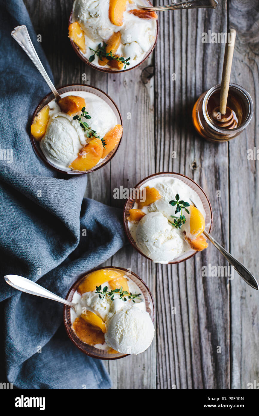 Honey & Lemon Thyme Ricotta Ice Cream with Vanilla Peaches Stock Photo