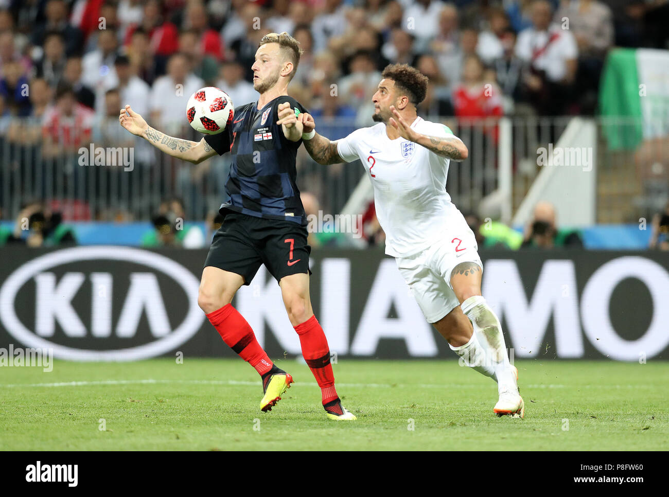 Croatia's Ivan Rakitic and England's Kyle Walker battle for the ball during the FIFA World Cup, Semi Final match at the Luzhniki Stadium, Moscow. PRESS ASSOCIATION Photo. Picture date: Wednesday July 11, 2018. See PA story WORLDCUP Croatia. Photo credit should read: Owen Humphreys/PA Wire. Stock Photo