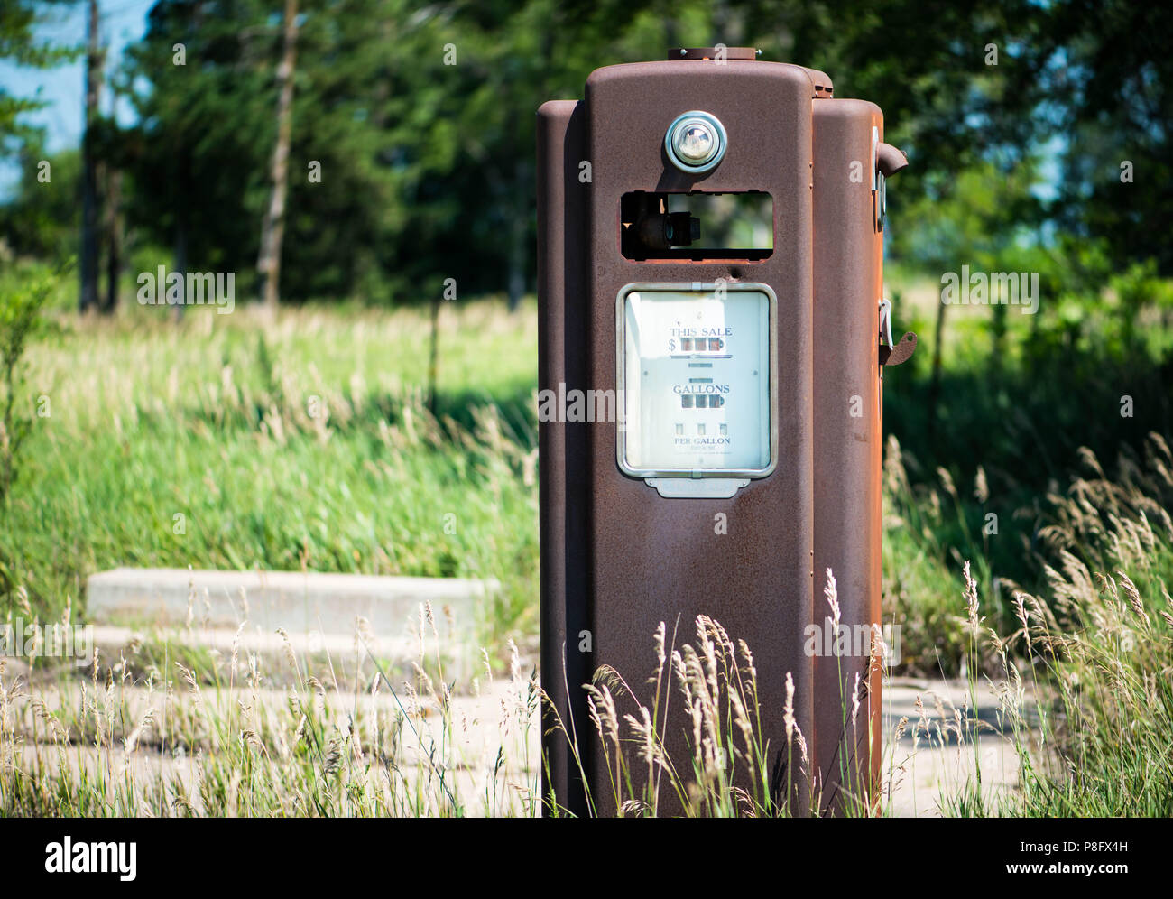 Rusty old gas pump at a abandoned gas station Stock Photo