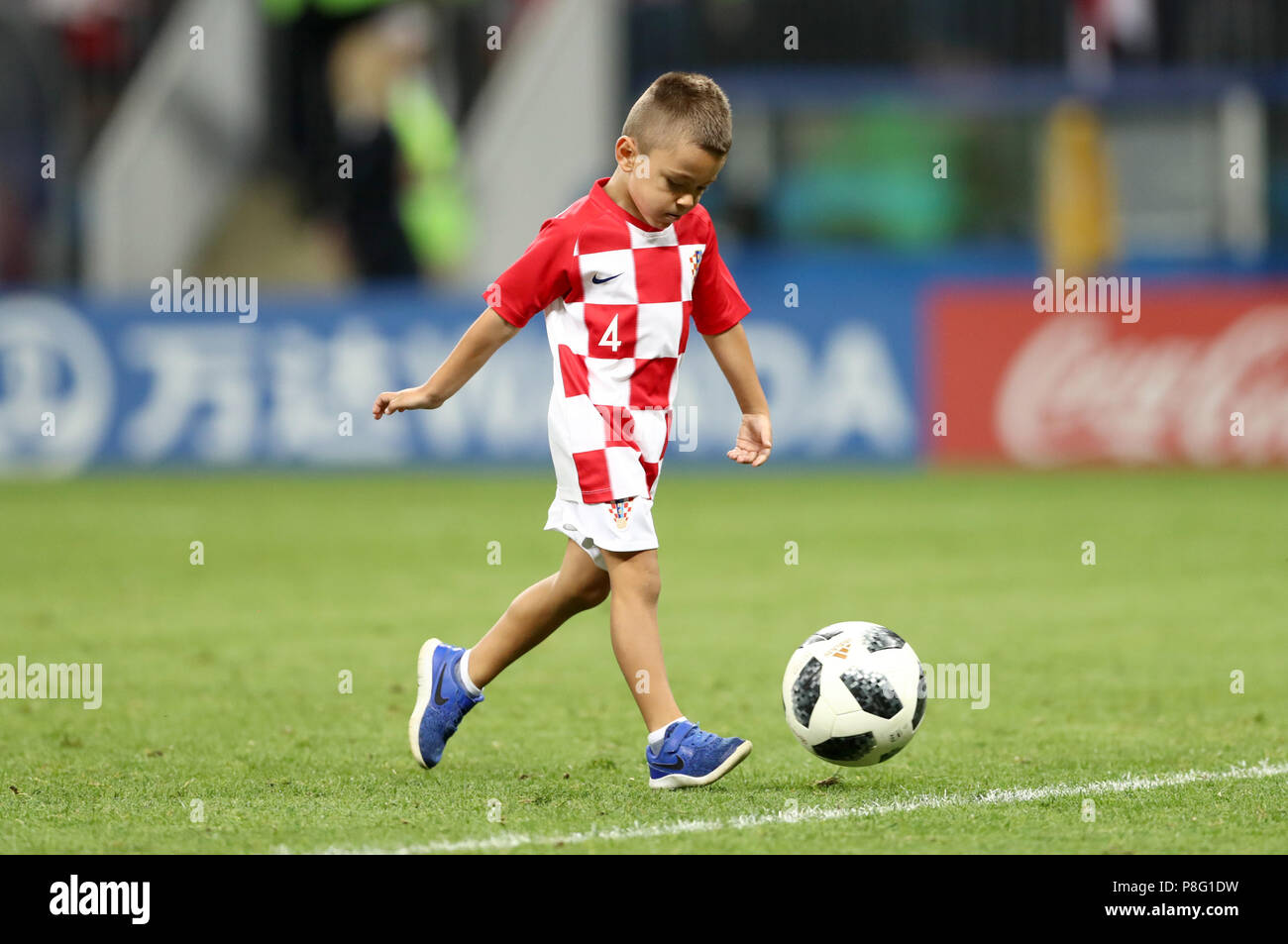 A young croatia fan wearing the shirt of Croatia's Ivan Perisic on the pitch after the final whistle of the FIFA World Cup, Semi Final match at the Luzhniki Stadium, Moscow. PRESS ASSOCIATION Photo. Picture date: Wednesday July 11, 2018. See PA story WORLDCUP Croatia. Photo credit should read: Tim Goode/PA Wire. RESTRICTIONS: Editorial use only. No commercial use. No use with any unofficial 3rd party logos. No manipulation of images. No video emulation. Stock Photo