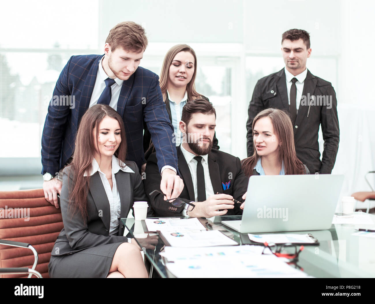 concept of teamwork - a successful business team in the workplace in ...