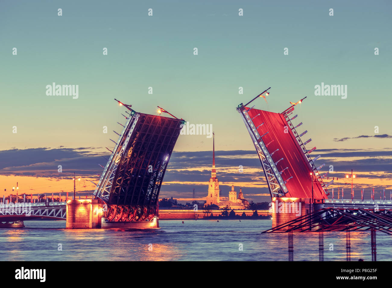 Open Palace Bridge and Peter and Paul Cathedral. White night in St ...