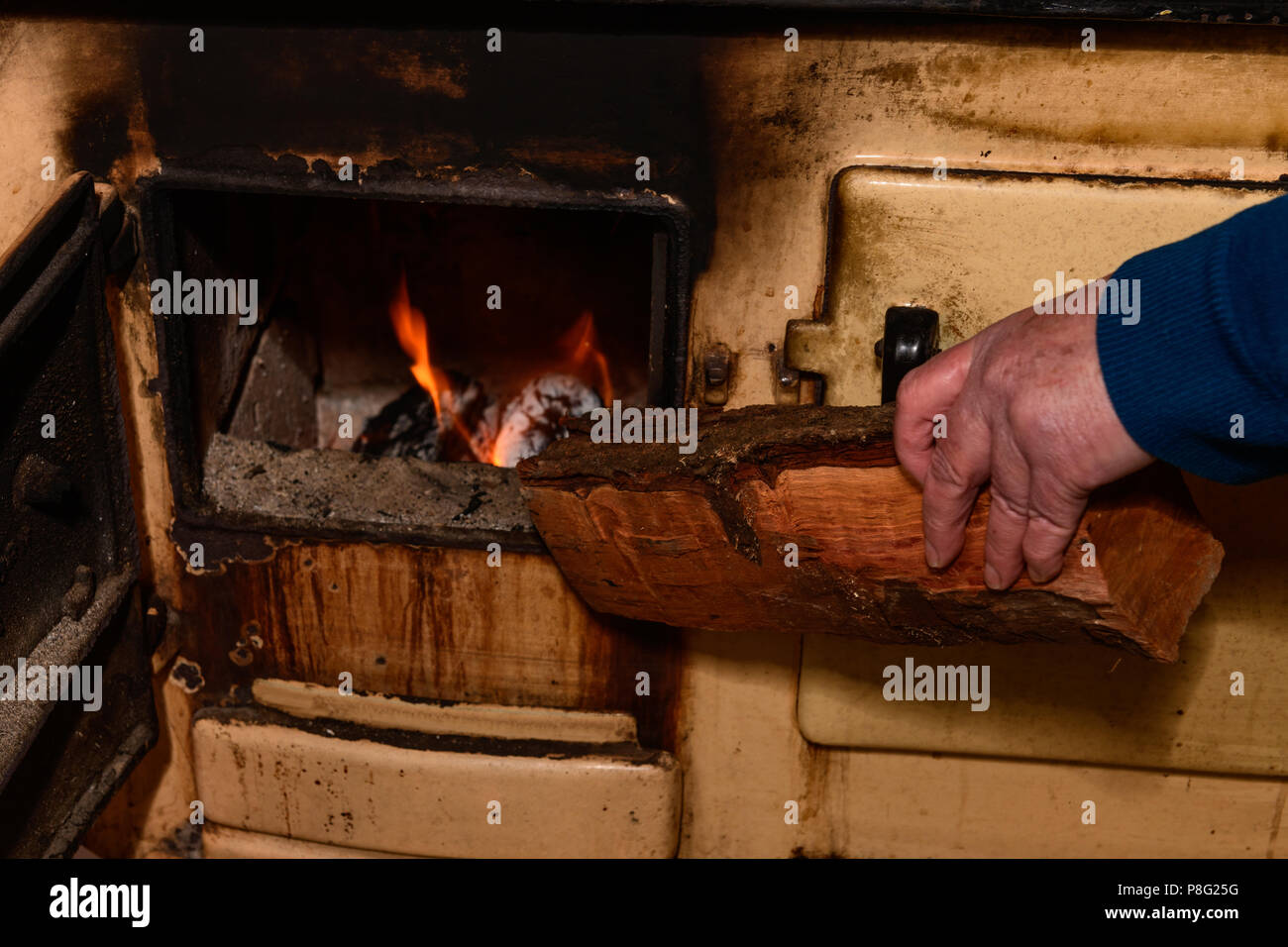 Winter And Putting Wood In The Stove Stock Photo 211794620 Alamy