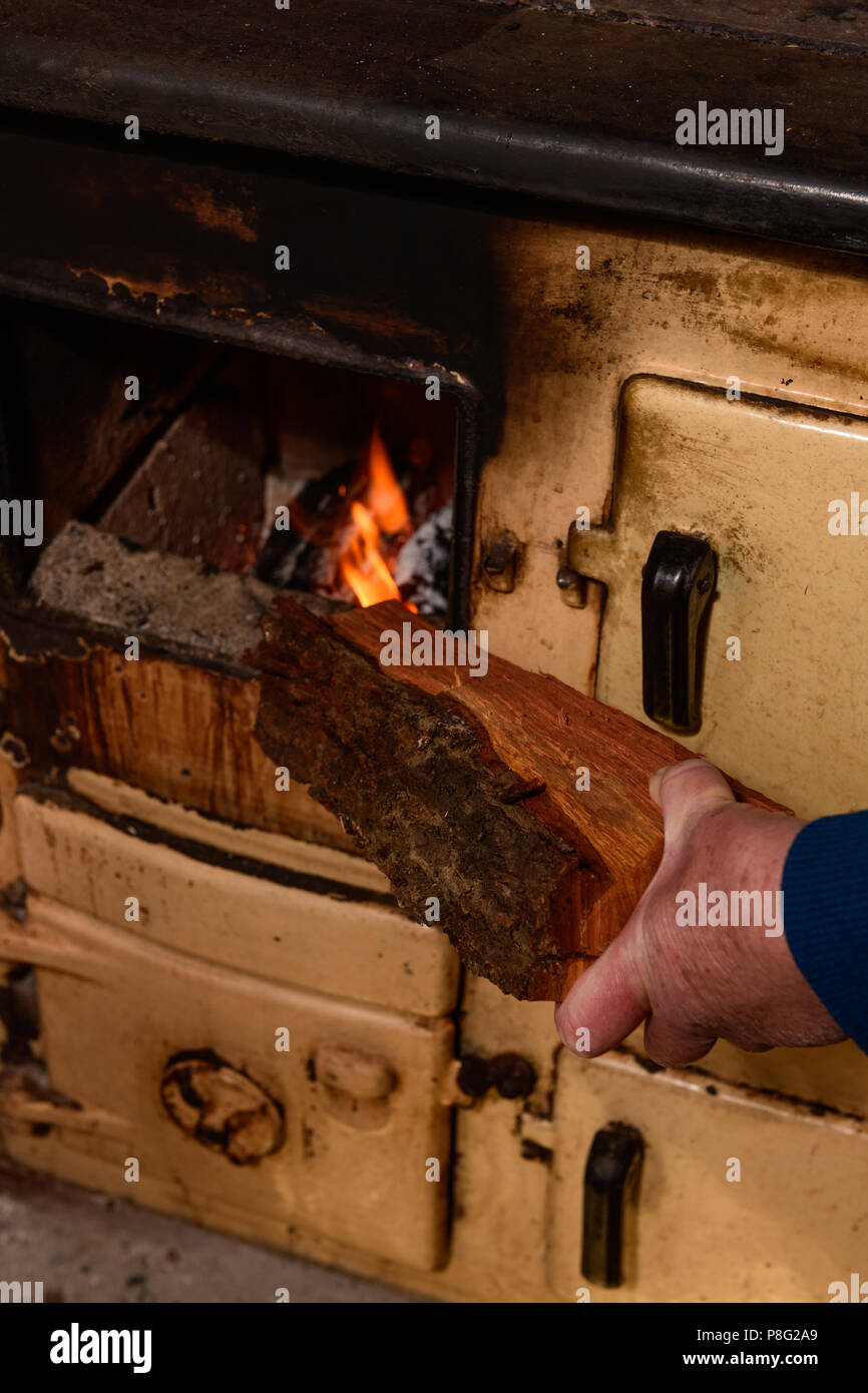 Winter And Putting Wood In The Stove Stock Photo 211794753 Alamy