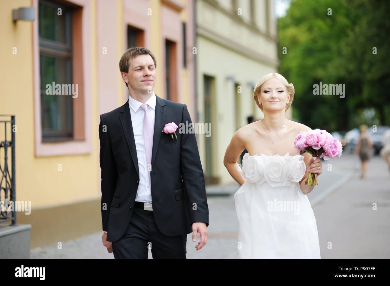 Bride and groom walking together Stock Photo - Alamy