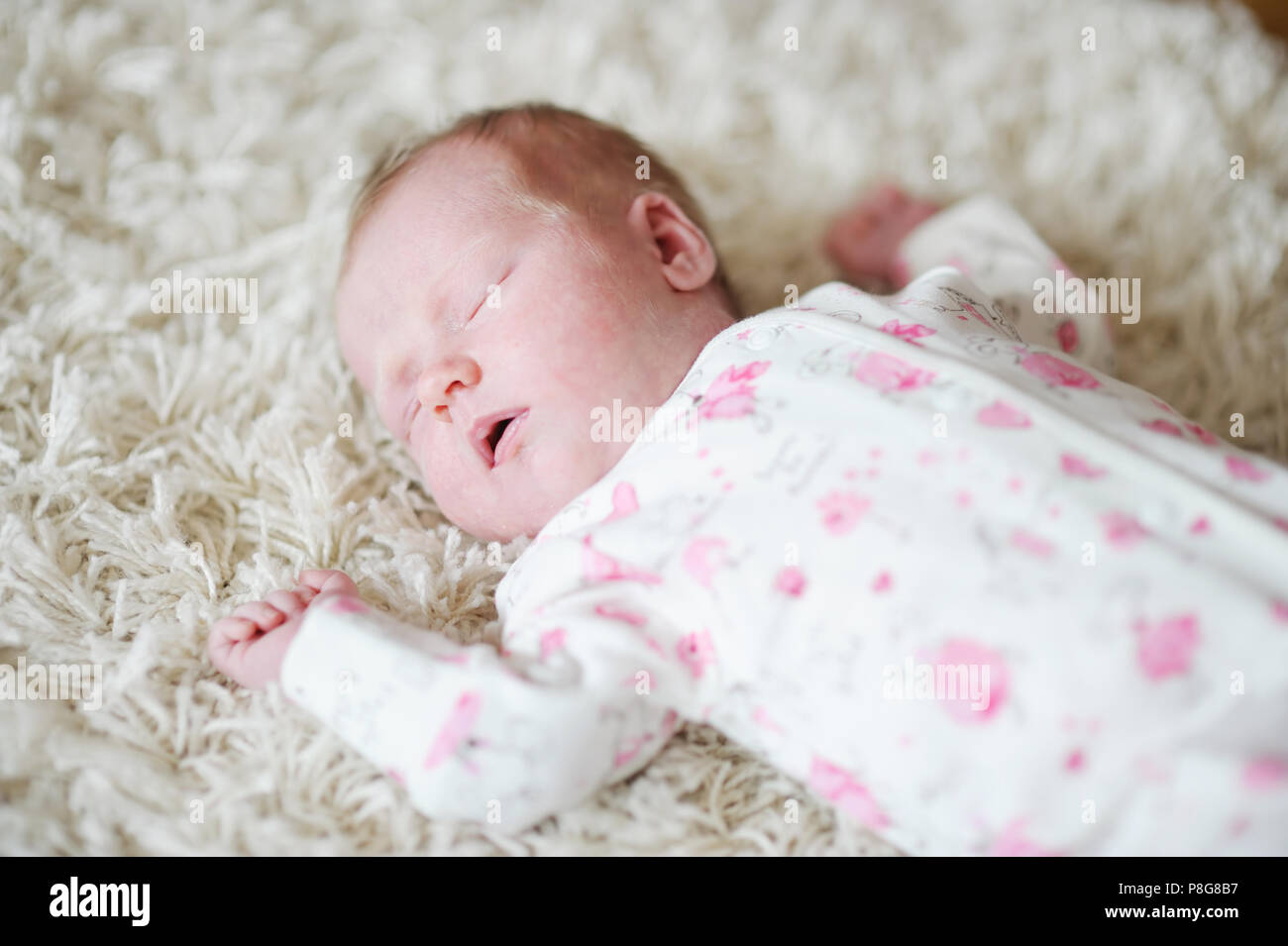 Adorable sleeping newborn baby girl portrait Stock Photo - Alamy