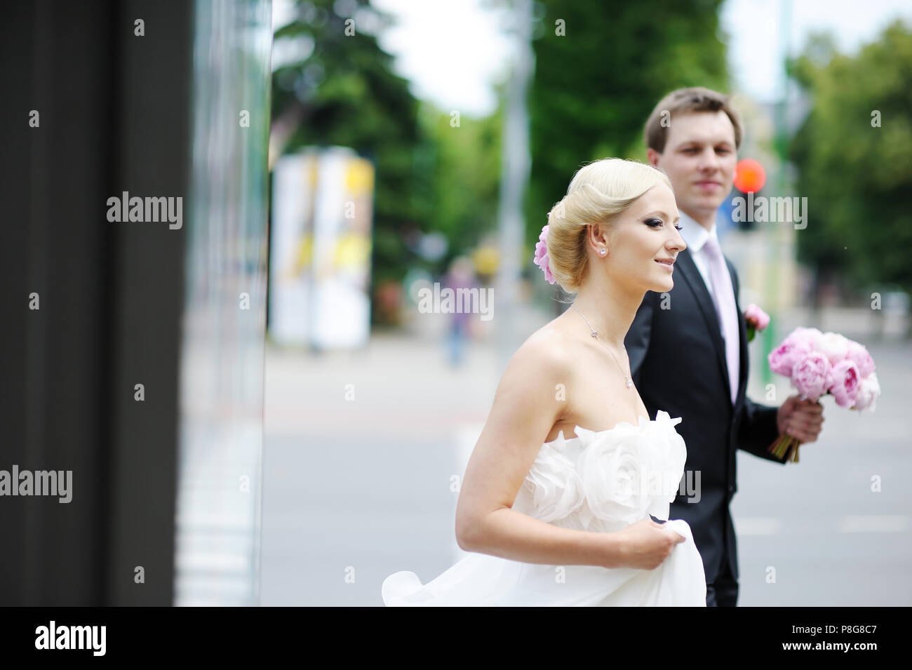 Bride and groom walking together Stock Photo - Alamy