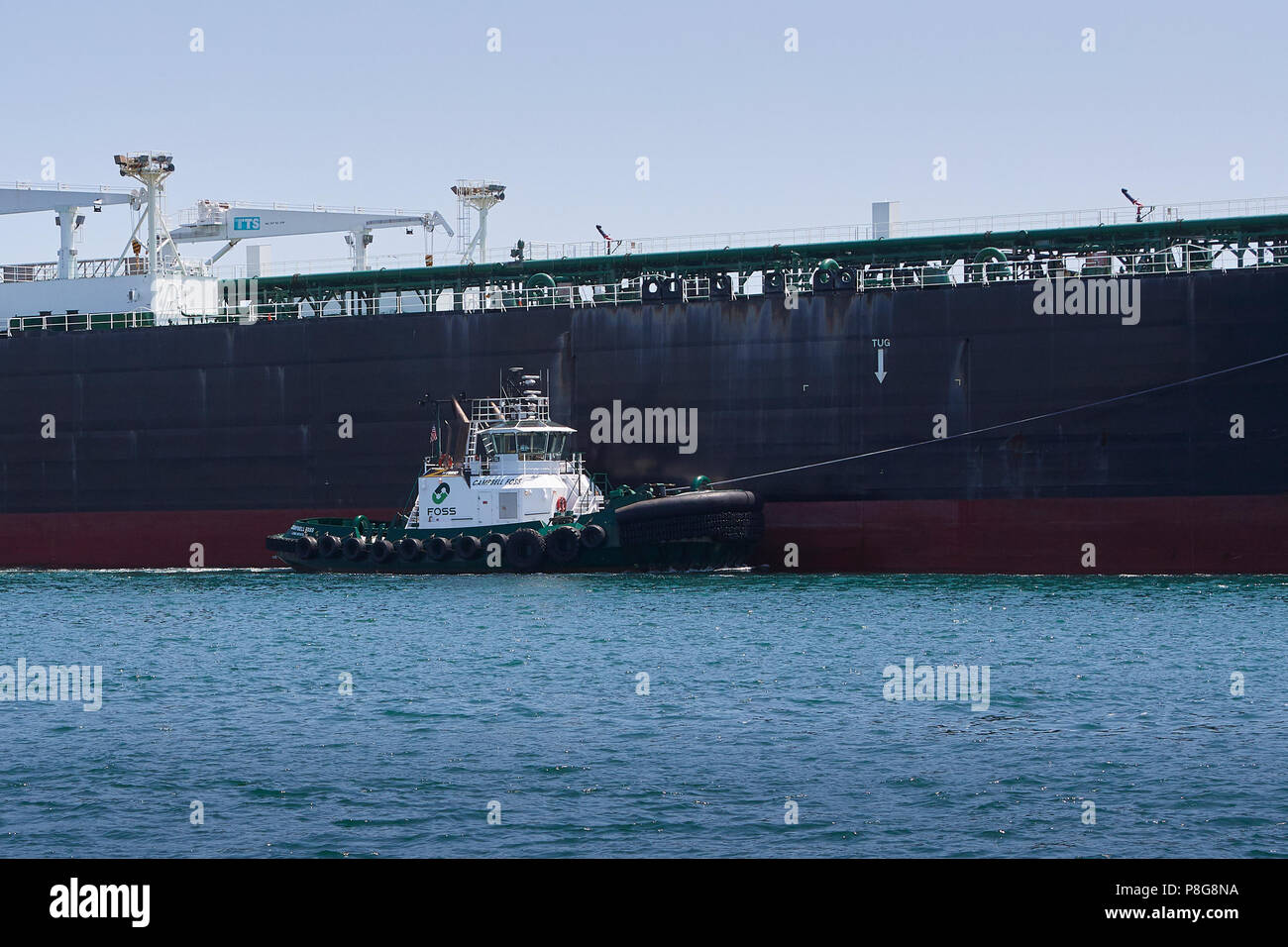 FOSS MARITIME Tugboat, CAMPBELL FOSS, Guides The Supertanker, ALASKAN NAVIGATOR, Entering The Port of Long Beach, California, USA. Stock Photo