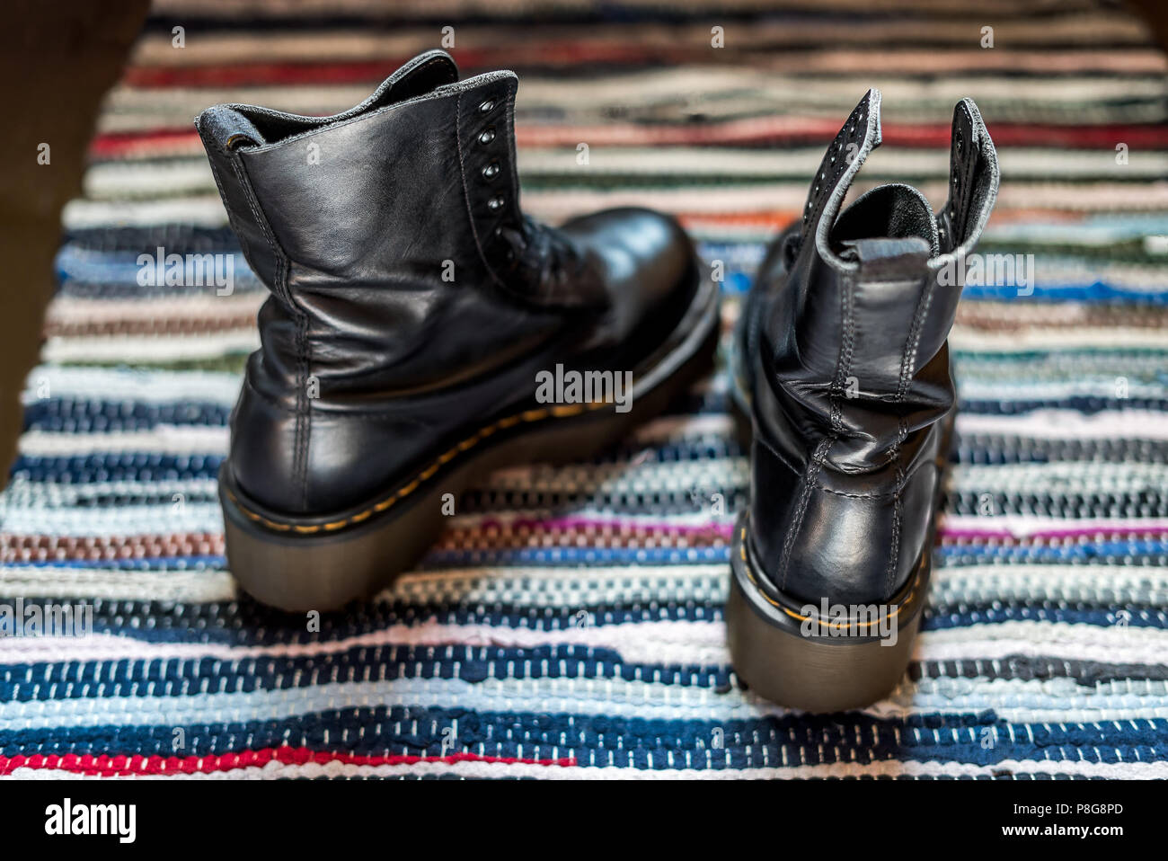 Youthful, rough autumn and winter footwear for a punk or hipster lifestyle. Stock Photo