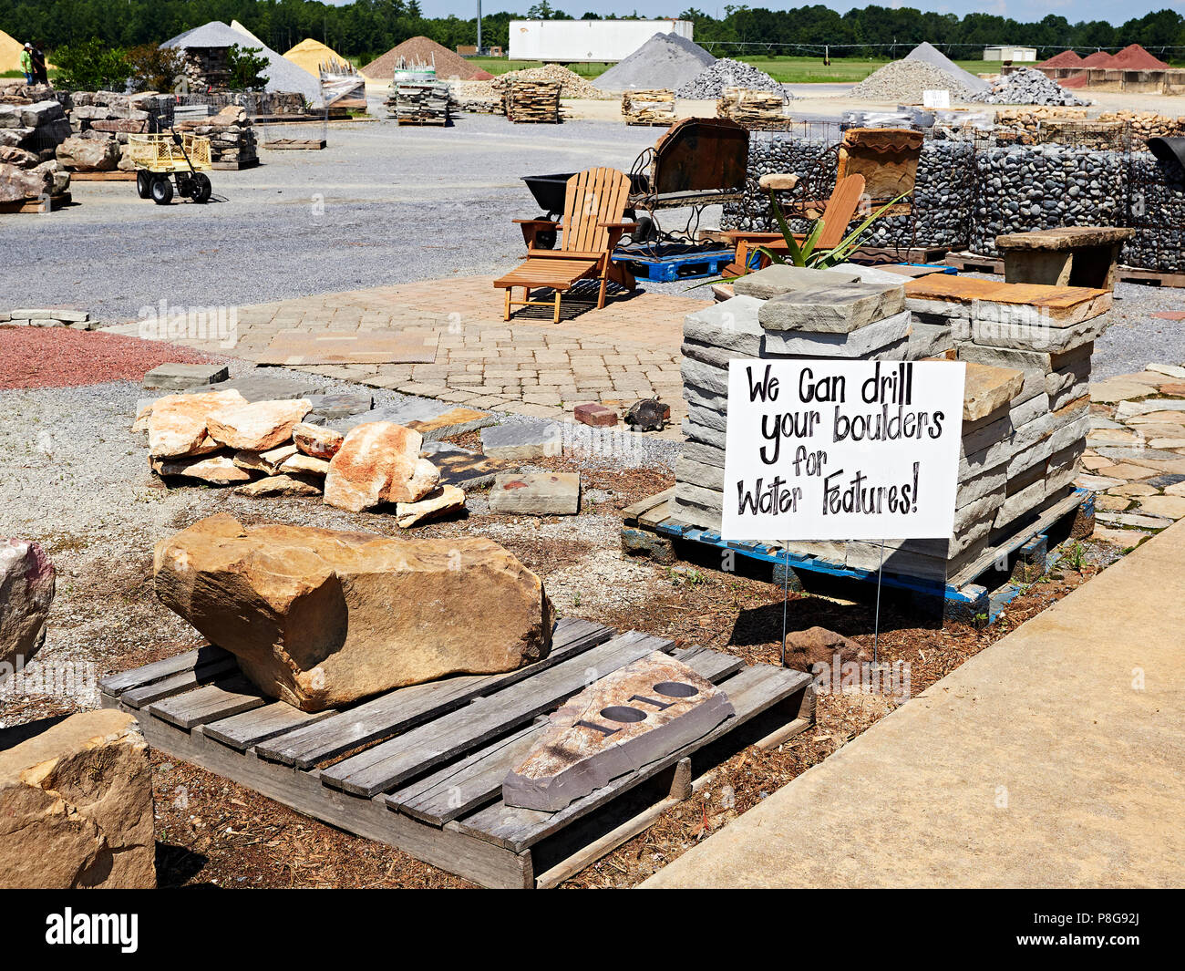 Landscaping materials yard with large rocks and stones used in landscaping construction work in