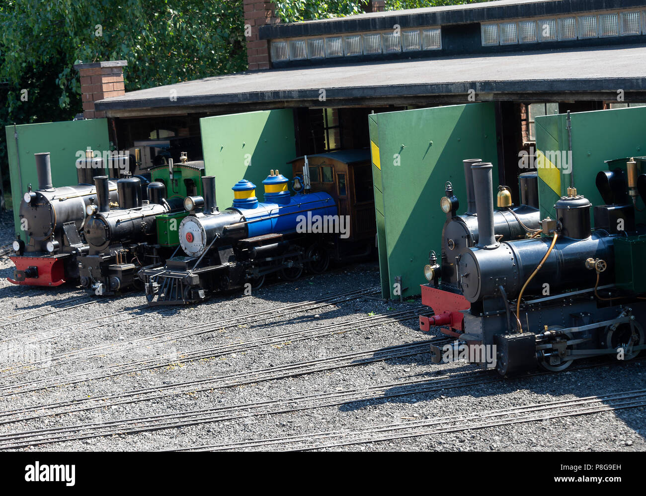 Miniature Swiss Steam Railway Engines in their Shed at The Swiss Vapeur Parc at Le Bouveret Lake Geneva Switzerland Stock Photo