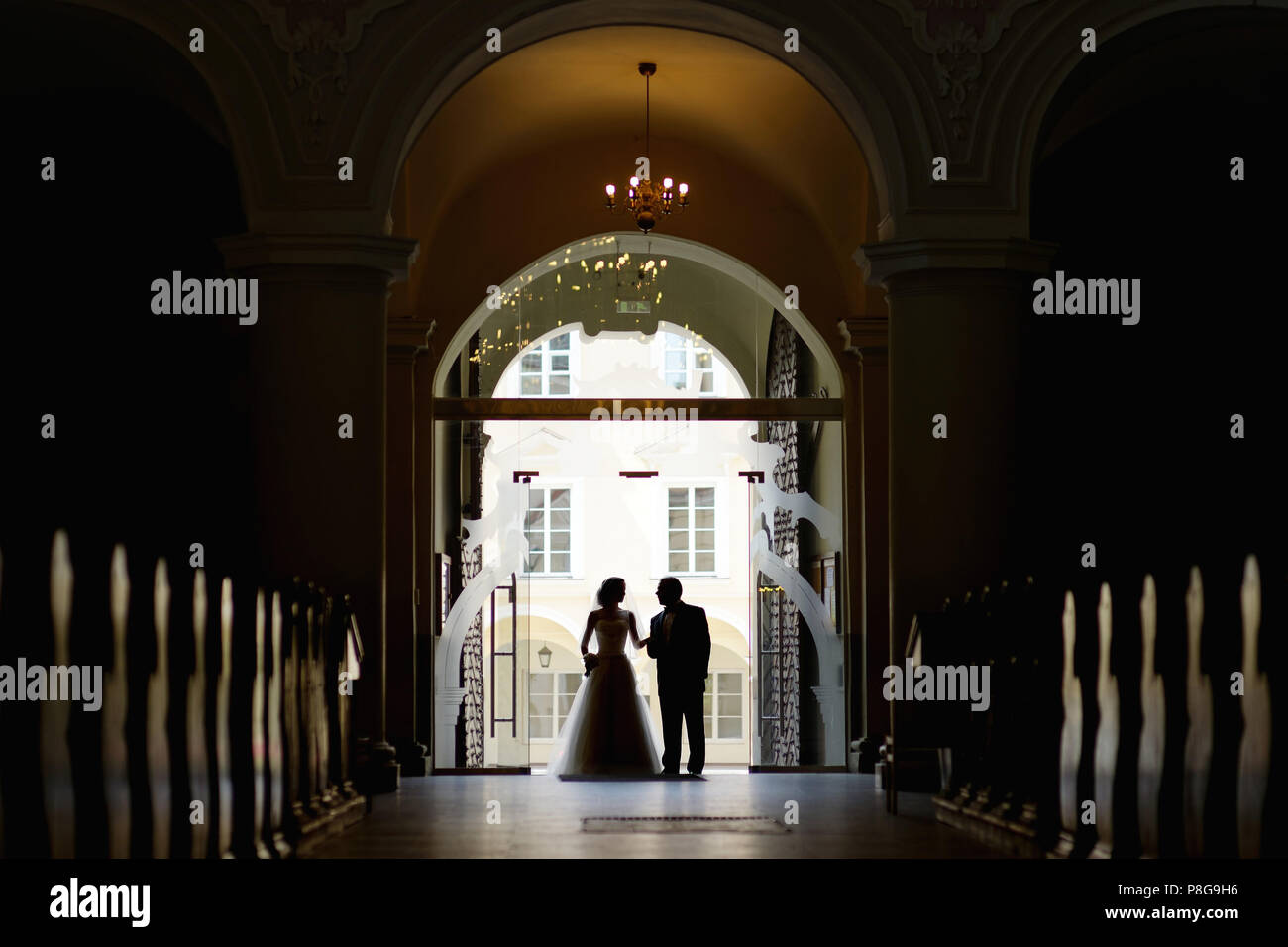 Bride walking down aisle with her father Stock Photo