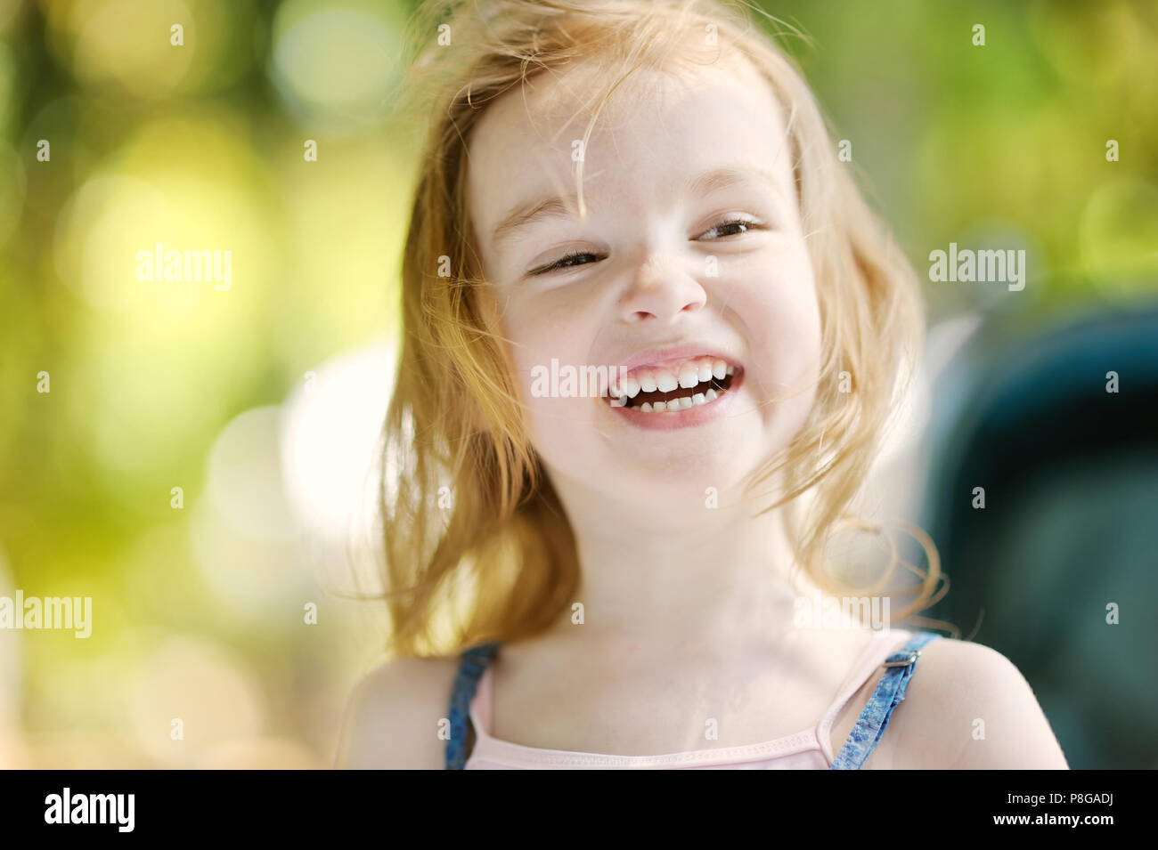 Adorable little girl portrait outdoors at summer Stock Photo - Alamy