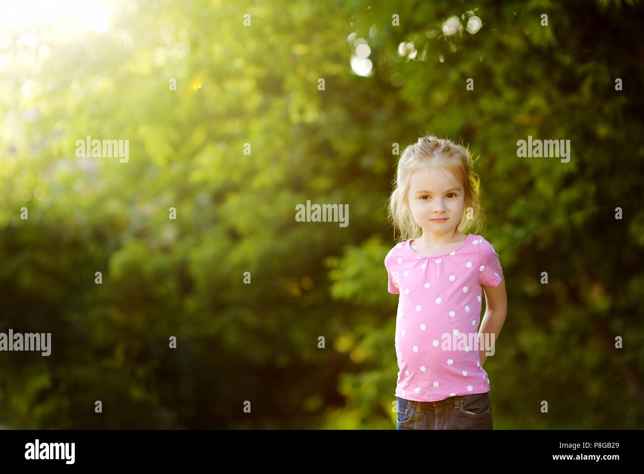 Adorable little girl portrait outdoors at summer Stock Photo - Alamy
