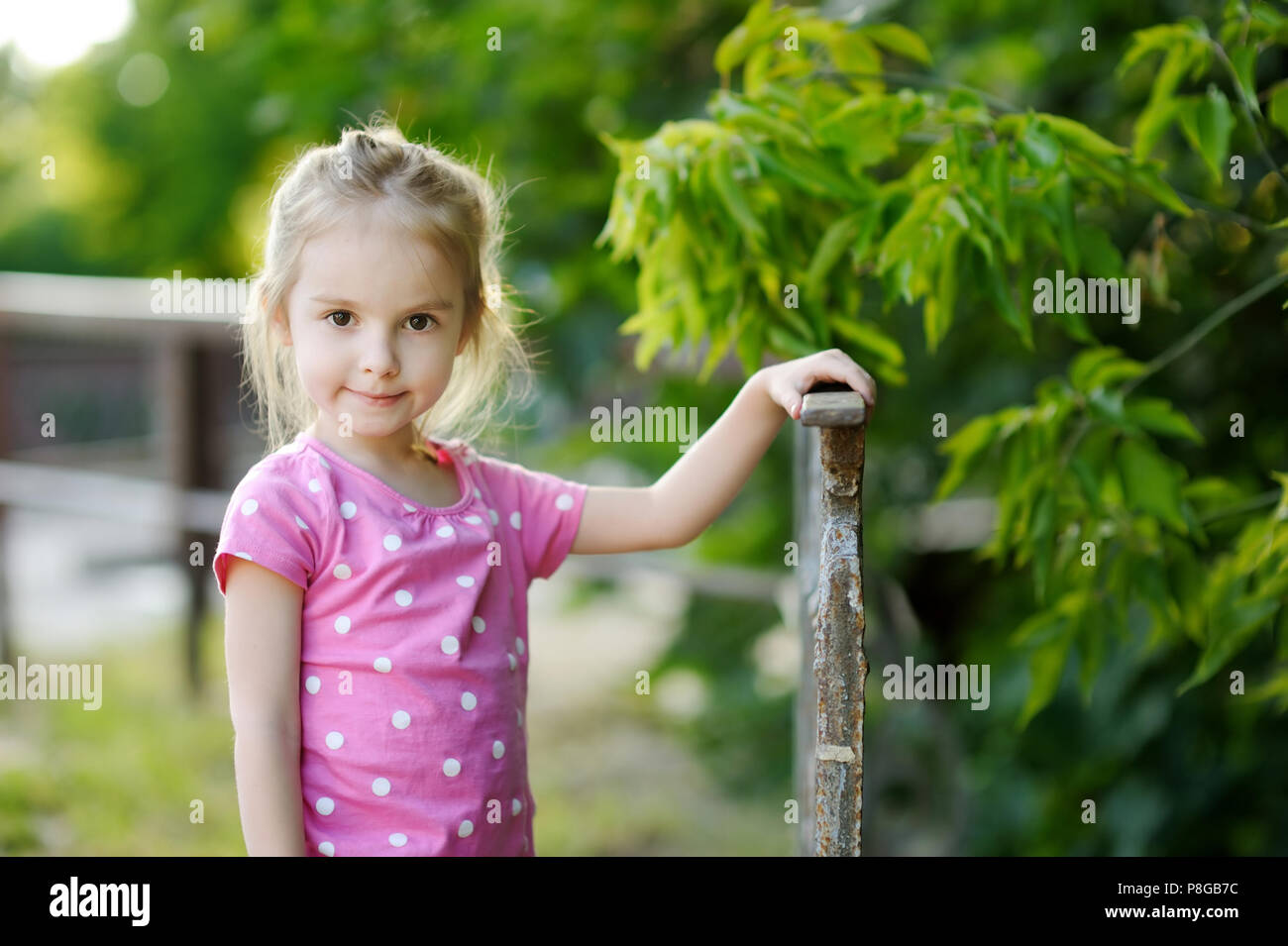 Adorable little girl portrait outdoors at summer Stock Photo - Alamy