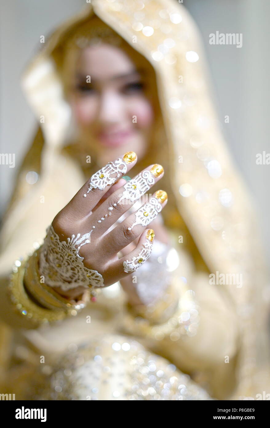 Beautiful Bride Hands with Henna Tattoo, Indonesian Wedding Tradition