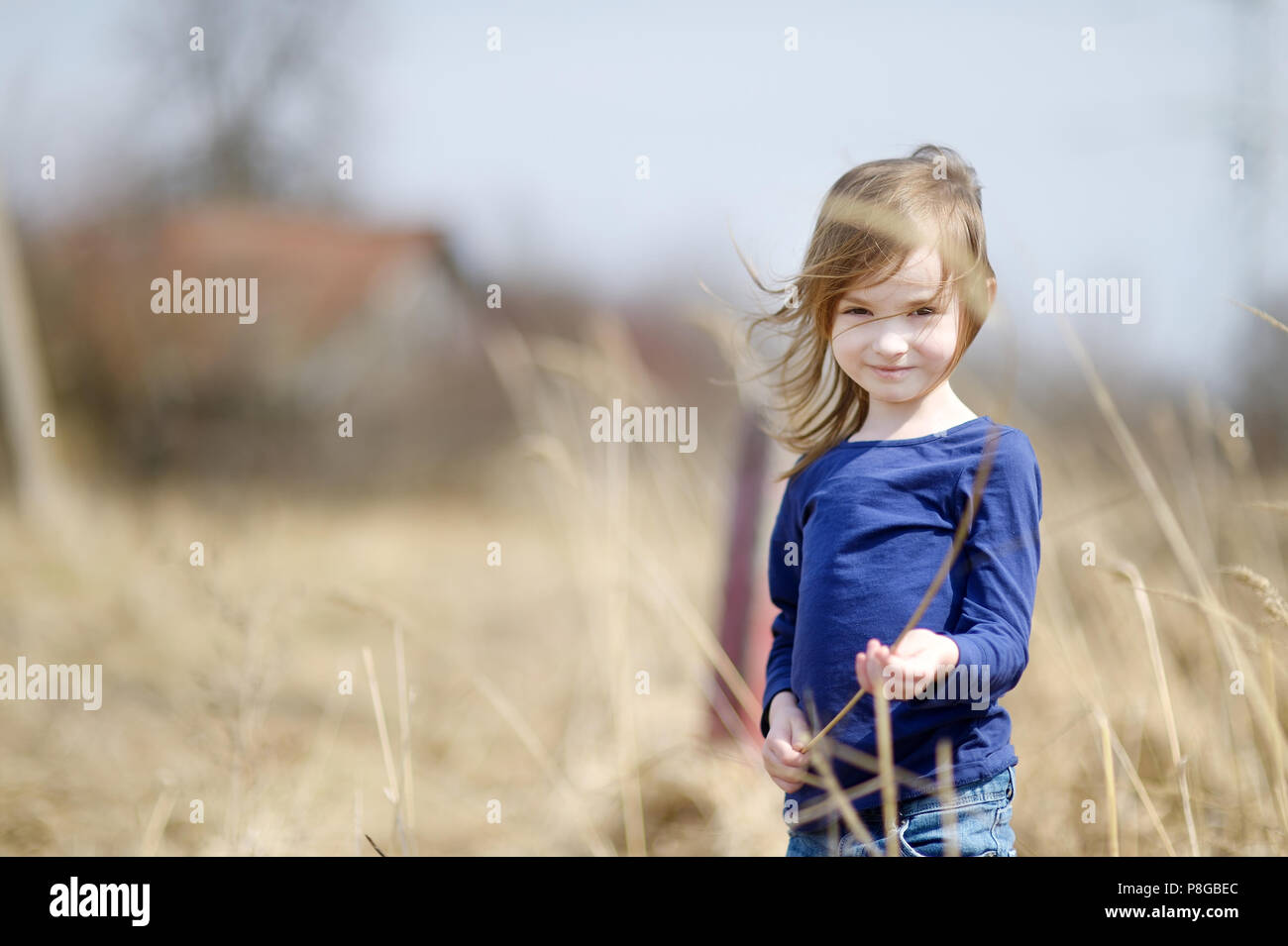 Adorable little girl portrait outdoors at summer Stock Photo - Alamy